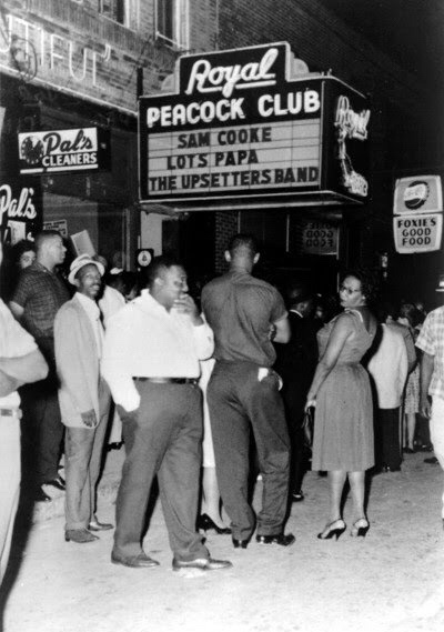 Crowds gather outside the famed Royal Peacock Club on Auburn Avenue in this photo from the 1960s. Originally named The Top Hat Club, the nightspot opened in 1938 and featured some of the top acts in show business, including Cab Calloway, Louis Armstrong, James Brown, Muddy Waters, Otis Redding, B.B. King, the Four Tops, Ray Charles, Sam Cooke, Wilson Pickett, The Supremes, Jackie Wilson, Little Richard, Aretha Franklin, Ike and Tina Turner and Gladys Knight and the Pips. The club, at 186 Auburn Avenue, reopened in 2010 and remains open today. Photo courtesy of Skip Mason Archives. Credit: AJC. 